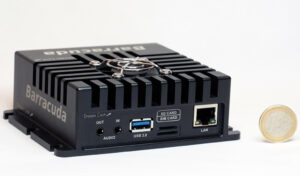 Product photo of rear-facing Barracuda encoder/decoder beside a 1-Euro coin.